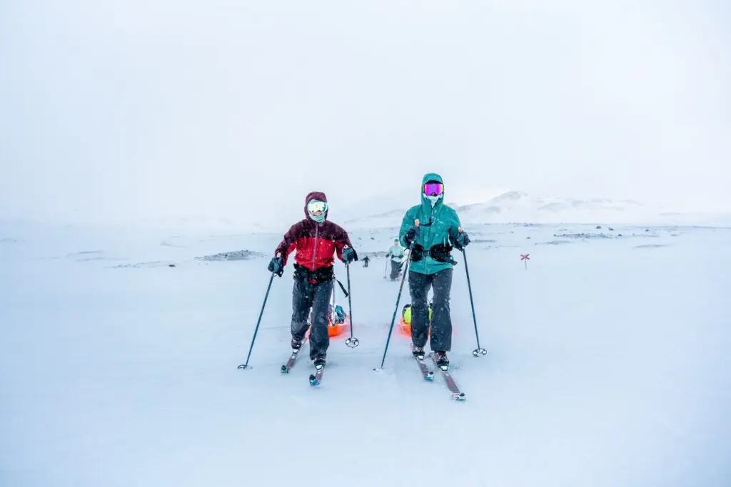 two people ski touring in snowy Swedish Lapland